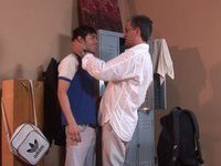 Mature man hugs young hunk and then they have a passionate gay sexual party in changing room