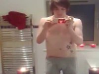 Tattooed twink has a camera out to record an emo gay tube